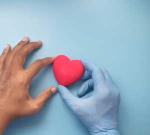 Red heart held between two hands